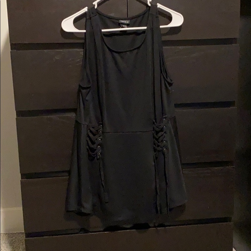 Black peplum top with lace up detail on sides